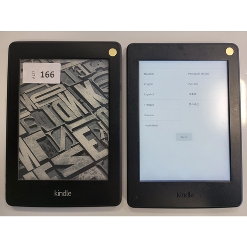 166 - TWO AMAZON KINDLE E-READERS
comprising a Paperwhite 3, serial number G090 G105 7115 0A35; and a Pape... 