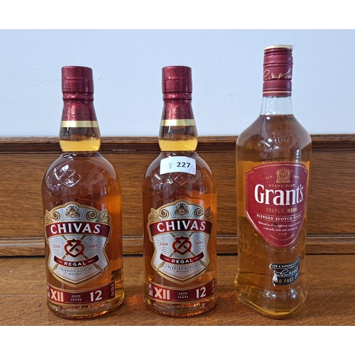 227 - THREE BOTTLES OF WHISKY
comprising two bottles of Chivas Regal 12 year Blended Scotch Whisky (700ml,... 