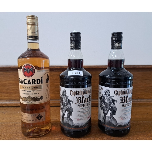 231 - THREE BOTTLES OF SPIRITS 
comprising two Captain Morgan Black Spiced (1L, 40%) and Bacardi Carta Oro... 