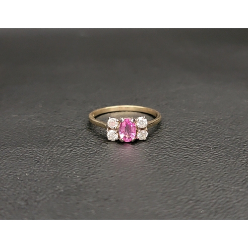 83 - PINK TOPAZ AND DIAMON CLUSTER RING
the central oval cut pink topaz flanked by two round cut diamonds... 