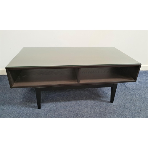 337 - BLACK ASH OCCASIONAL TABLE
with a rectangular top above two open shelves, standing on tapering suppo... 