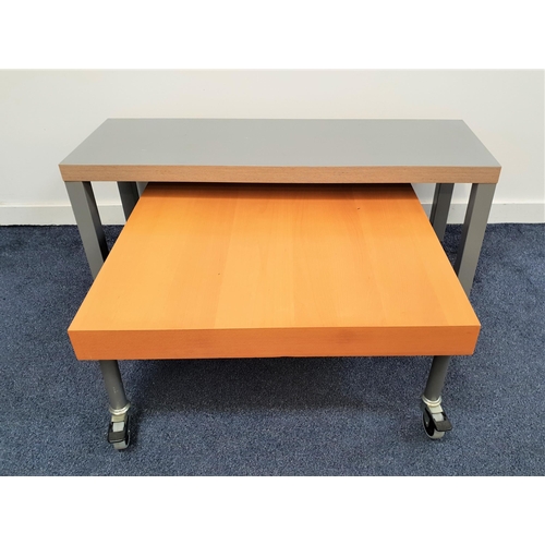 360 - BEECH OCCASIONAL TABLE
with a square top standing on tubular metal legs with casters, 80cm wide, tog... 