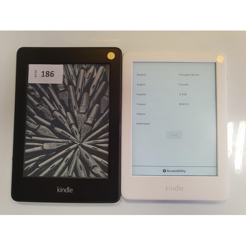 186 - TWO AMAZON KINDLE E-READERS
comprising a Paperwhite 3, serial number G090 WF06 1326 09WN; and a Pape... 