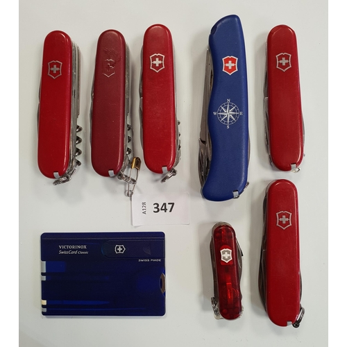 347 - SEVEN VICTORINOX SWISS ARMY KNIVES
of various sizes and designs; together with a Victorinox SwissCar... 