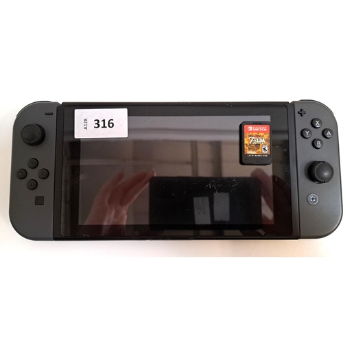 316 - NINTENDO SWITCH 
s/n XAN70014283836, with The Legend of Zelda Breath of the Wild game