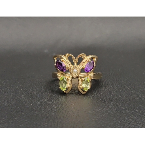 74 - INTERESTING BUTTERFLY 'SUFFRAGETTE' RING 
the butterfly set with a central seed pearl flanked by two... 