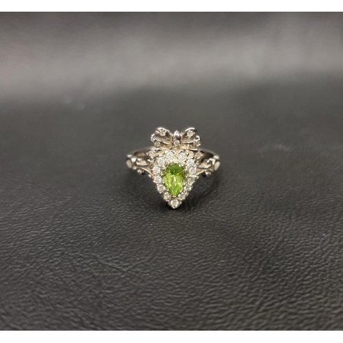 100 - PERIDOT AND DIAMOND CLUSTER RING 
the pear cut peridot measuring approximately 0.39cts surrounded by... 