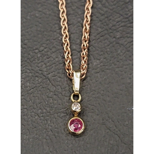 NINE CARAT ROSE GOLD NECKCHAIN
with a diamond and ruby pendant, approximately 4.8 grams