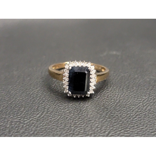 72 - SAPPHIRE AND DIAMOND CLUSTER RING
the central rectangular sapphire in twenty-four diamond surround, ... 