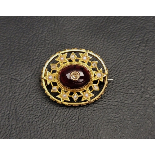 83 - VICTORIAN GARNET, DIAMOND AND SEED PEARL SET BROOCH
the central cabochon garnet inset with central d... 