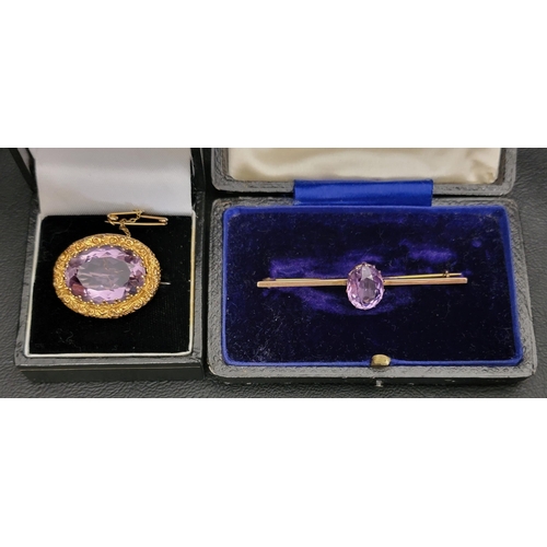 85 - TWO AMETHYST SET NINE CARAT GOLD BROOCHES 
one with large central oval cut amethyst measuring approx... 