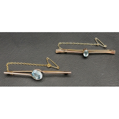 103 - TWO AQUAMARINE SET BAR BROOCHES
both in nine carat gold, one with twist setting, 6.2cm long, the oth... 