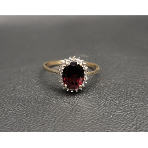 106 - GARNET AND DIAMOND CLUSTER RING
the oval cut garnet approximately 1.8cts in illusion setting with sm... 