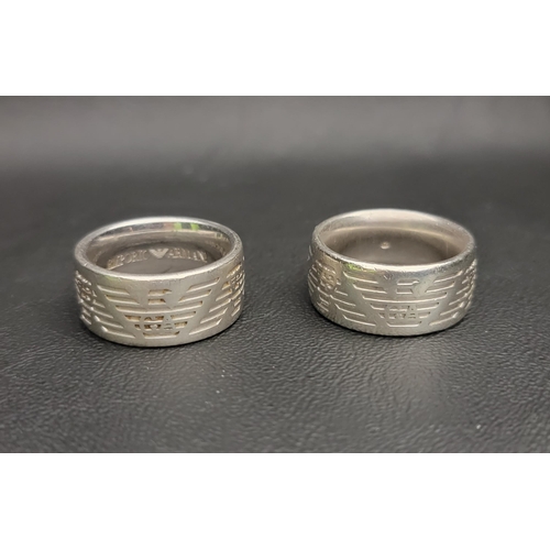 77 - TWO SILVER EMPORIO ARMANI RINGS
both heavy bands with continuous logo detail, ring sizes U-V and T-U... 