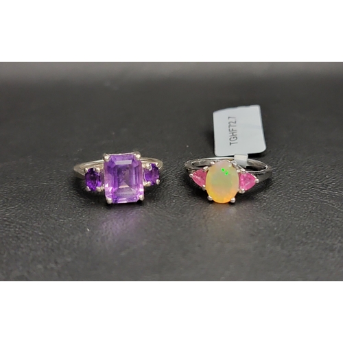 90 - TWO GEM SET RINGS AND MATCHED PAIRS OF EARRINGS
comprising an amethyst three stone ring together wit... 