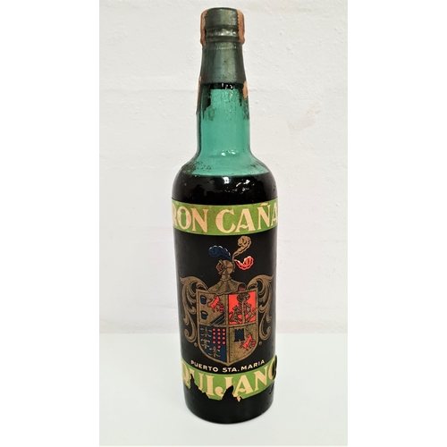 RON CANA QUIJANO CIRCA 1930 
an extremely rare rum that we estimate to date from circa 1930s. Ron Cana Quijano, Puerto Santa Maria. Level mid-top shoulder. No volume or strength statements. Label has staining and a couple of largish tears to bottom. 1 bottle