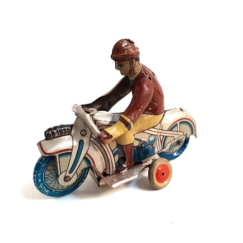 250 - FAIRYLITE TINPLATE CLOCKWORK MOTORBIKE AND RIDER
the wheels marked Fairylite 905x135, 10.5cm long