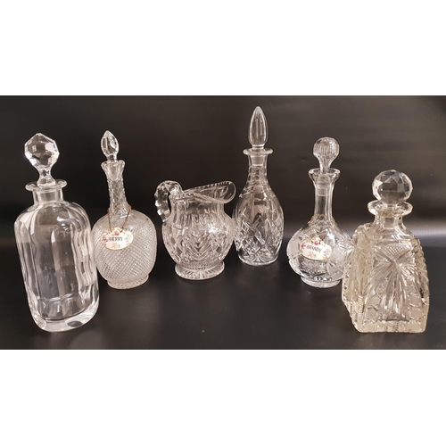 152 - FIVE VARIOUS CUT GLASS DECANTERS
and stoppers, two with porcelain decanter labels, brandy and Sherry... 