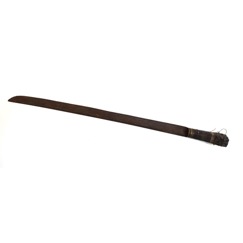 262 - PAWIAN SWORD
with a steel blade and ornate carved wood handle with two wire grip bands, overall 69cm... 