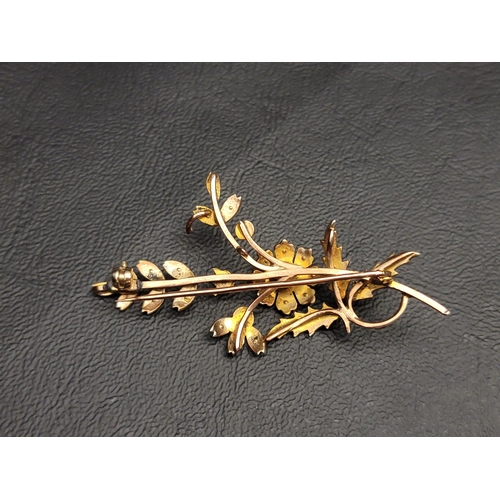 79 - SEED PEARL SET SPRAY BROOCH
in nine carat gold, 5.8cm long and approximately 6.3 grams