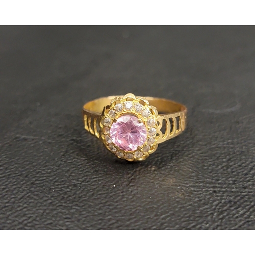 115 - HIGH CARAT GOLD CLUSTER RING
the central round cut pink paste with a CZ surround, on a high carat go... 