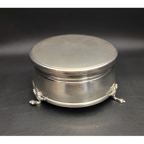 131 - SILVER TRINKET BOX
the circular box raised on three paw feet, with hinged cover and velvet lined int... 