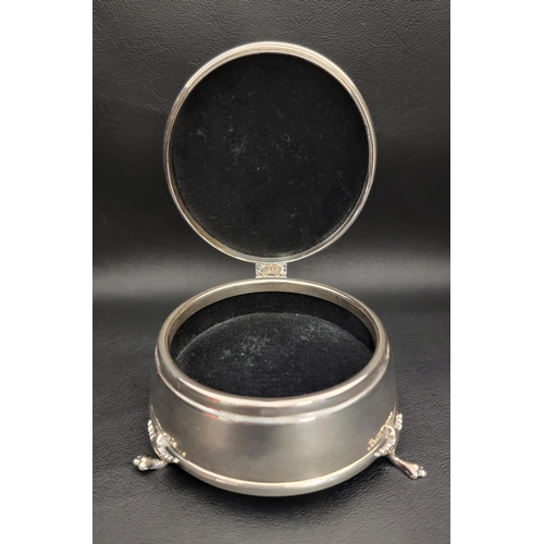 131 - SILVER TRINKET BOX
the circular box raised on three paw feet, with hinged cover and velvet lined int... 