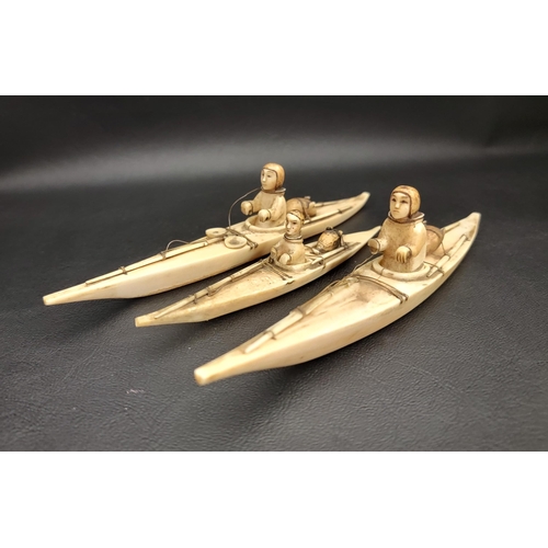 216 - THREE 19th CENTURY CARVED BONE INUITS
in canoes, two 16.5cm long and one 12cm long (3)