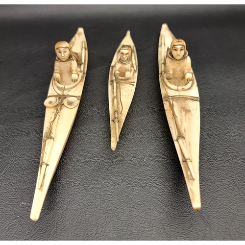 216 - THREE 19th CENTURY CARVED BONE INUITS
in canoes, two 16.5cm long and one 12cm long (3)