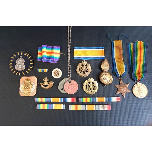 258 - SELECTION OF MILITARY BADGES AND MEDALS
including a WWI victory medal, The 1934-1945 Star, various r... 