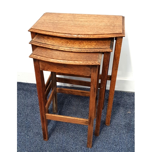 441 - 1930s OAK NEST OF TABLES
with moulded bow fronts, standing on plain supports, the largest 54.5cm hig... 