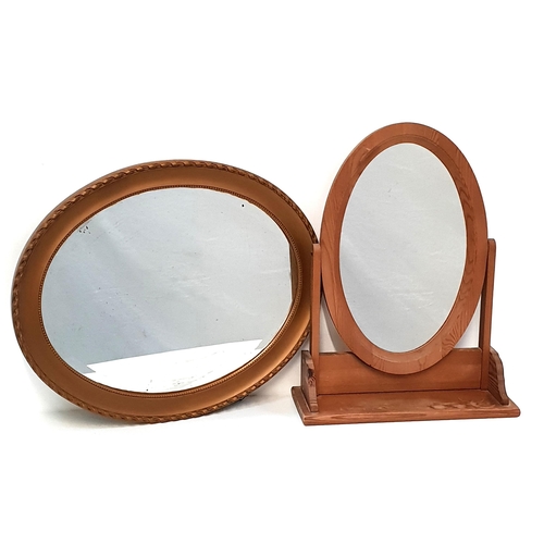 445 - PINE TOILET MIRROR
with an oval plate, 55.5cm x 42cm, together with an oval wall mirror with a bevel... 