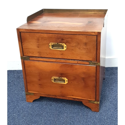 348 - YEW BEDSIDE CHEST
with a brass three quarter galleried top above two drawers with flush fitting bras... 