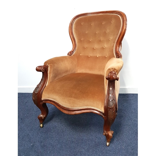 365 - VICTORIAN ARMCHAIR
with a shaped button back and shaped seat, standing on ornate cabriole front supp... 