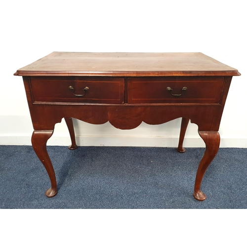 366 - EARLY VICTORIAN MAHOGANY SIDE TABLE
with a moulded top above two frieze drawers, standing on cabriol... 