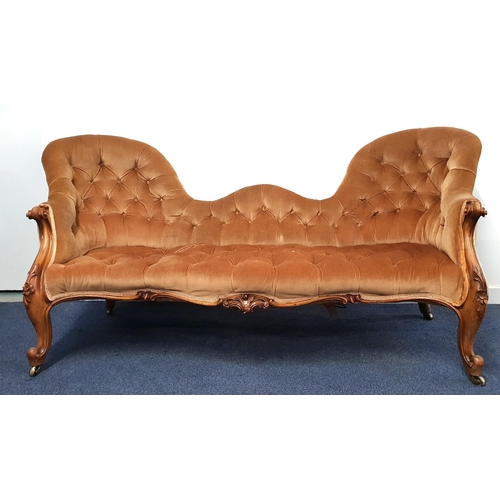 371 - VICTORIAN WALNUT DOUBLE SPOON BACK SOFA
with a button back and seat with scroll arms, standing on sh... 