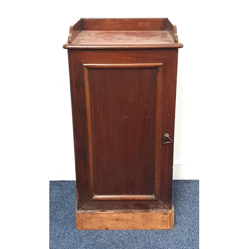 401 - VICTORIAN MAHOGANY BEDSIDE CUPBOARD
with a three quarter galleried top above a panelled door, standi... 