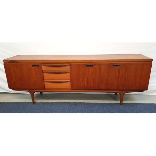 452 - GREAVES & THOMAS TEAK SIDEBOARD
with a rectangular top above an arrangement of three cupboard doors ... 