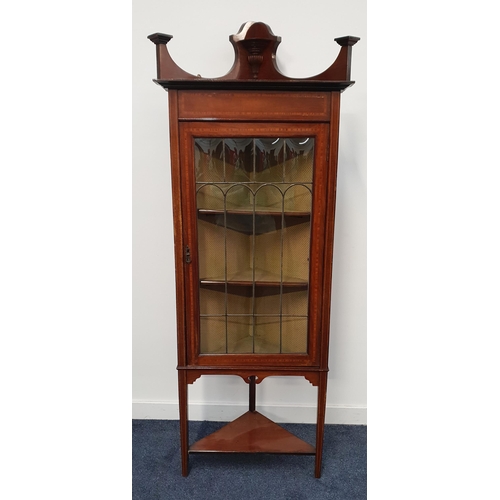 396 - EDWARDIAN MAHOGANY AND CROSSBANDED FLOORSTANDING CORNER CABINET
with a shaped raised back above a pa... 