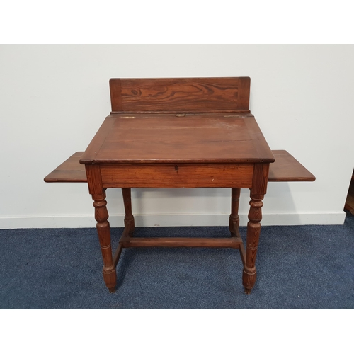 405 - 19th CENTURY PINE CLERKS DESK
with a raised back above a central inkwell and sloping lift up lid fla... 