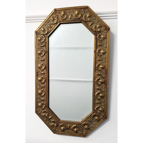 418 - OCTAGONAL BRASS WALL MIRROR
with an embossed frame and bevelled plate, 74.5cm x 44cm