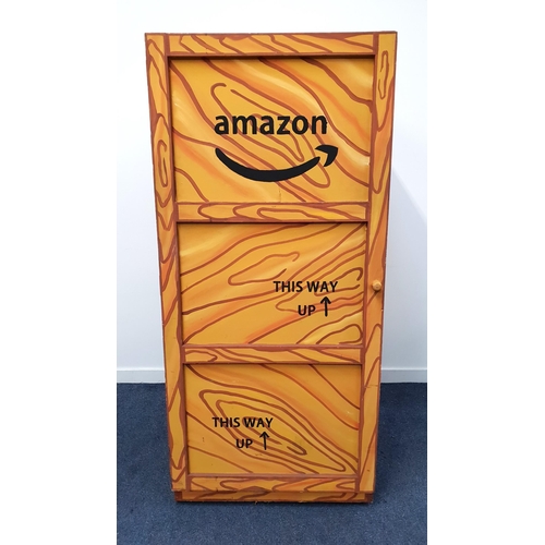 201 - MAGICIAN'S ILLUSION STAGE PROP - DISAPPEARING BOX
decorated as an Amazon packing crate, with rotatin... 