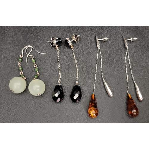 THREE PAIRS OF SILVER MOUNTED DROP EARRINGS
comprising one pair set with jade coloured hardstone beads, in unmarked silver; another pair with amber and the final pair with faceted haematite