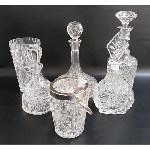 225 - SELECTION OF CUT GLASS DECANTERS
comprising a ship's decanter and stopper, wine decanter and stopper... 