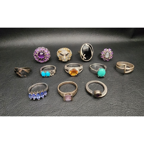 16 - INTERESTING SELECTION OF TWELVE SILVER RINGS
including a multi gem set leopard head ring, an amethys... 