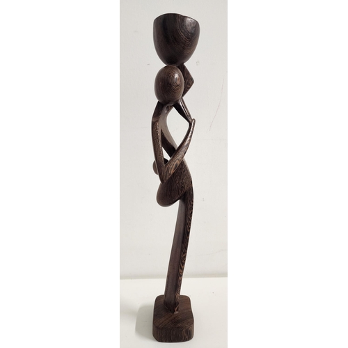 310 - CLIVE VINCENT JACHNIK
Congolese female water carrier, carved wenge, 42cm high