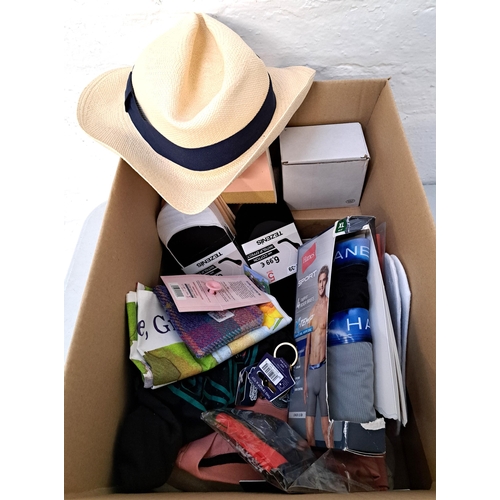 ONE BOX OF NEW ITEMS
including clothing, coasters, mugs, souvenirs, sun hat