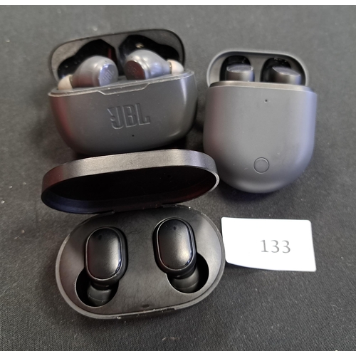 THREE PAIRS OF EARBUDS IN CHARGING CASES
comprising 2x Redmi and 1x JBL