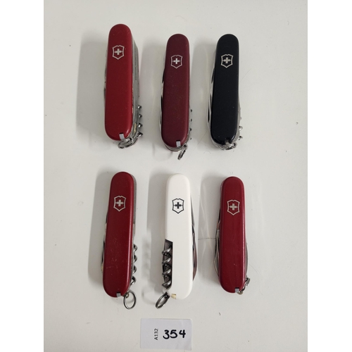 SIX VICTORINOX SWISS ARMY KNIVES
of various sizes and designs, one with personalisation 
Note: You must be over the age of 18 to bid on this lot.