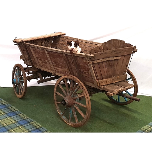 293 - VINTAGE ELM AND OAK UTILITY HORSE CART
with four wood and iron banded wheels and a pivoting front ax... 